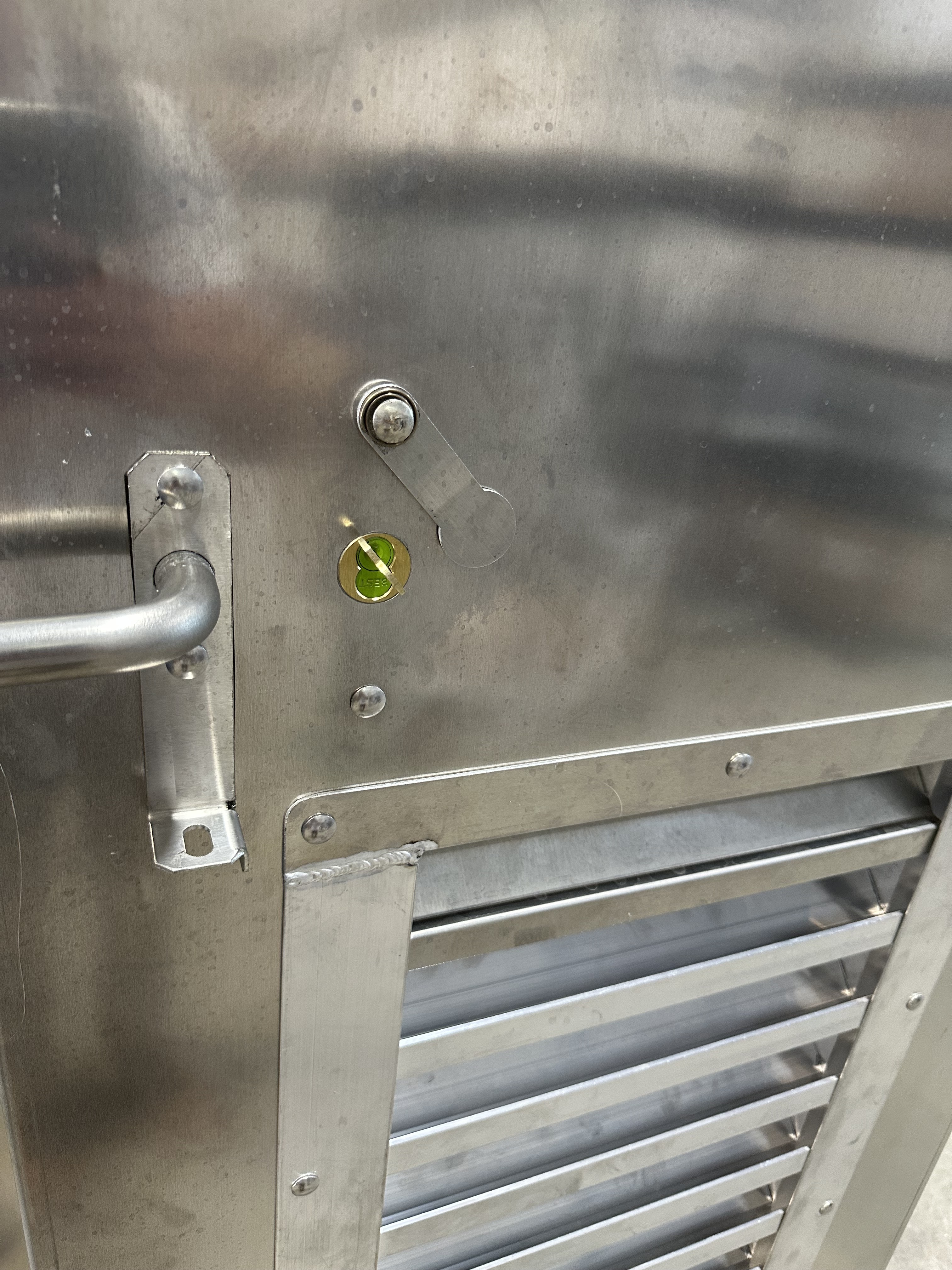 Lock cylinder detail on metal enclosure door