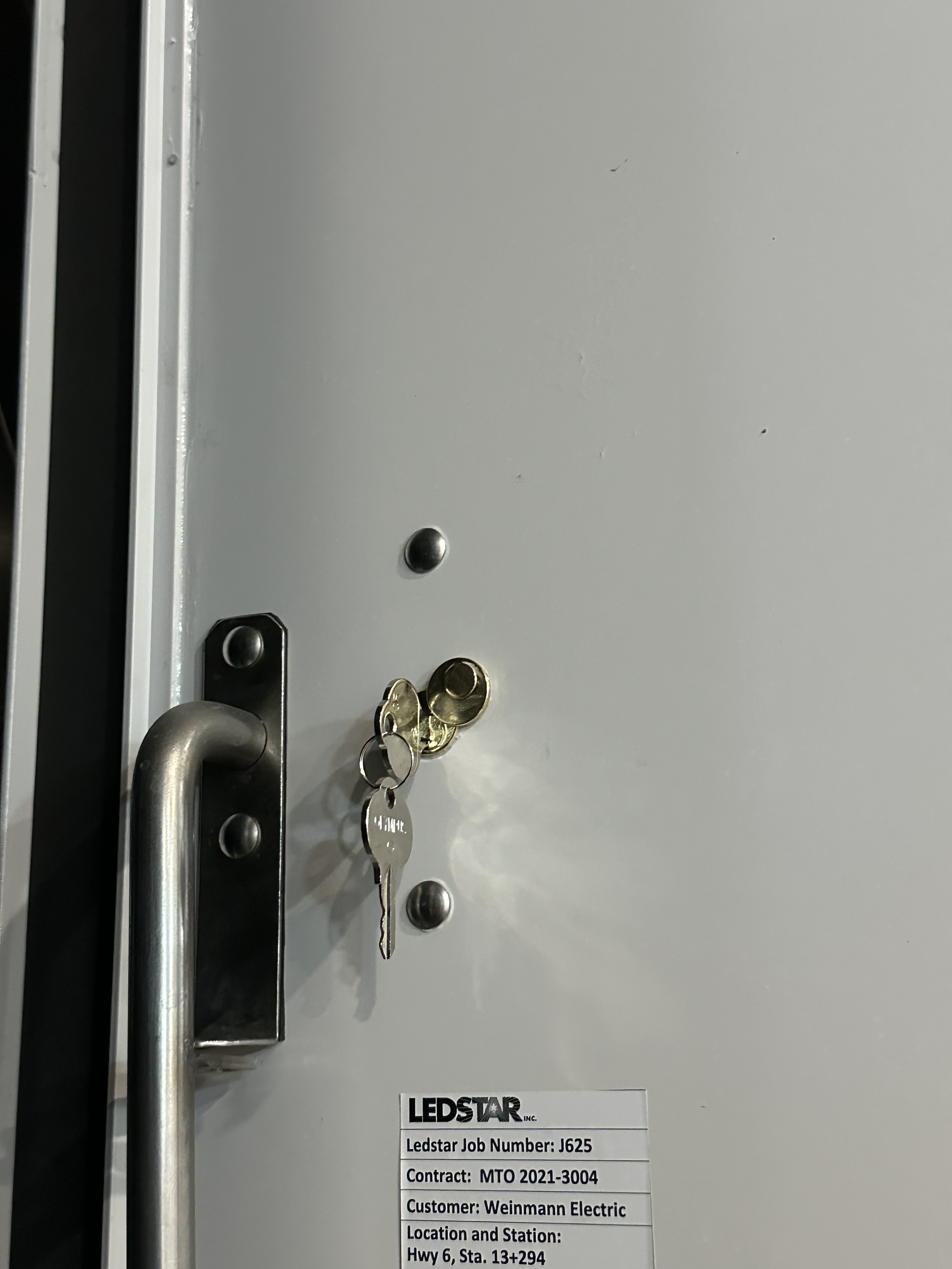 Complete traffic control cabinet with installed lock system